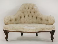 Lot 1408 - A Victorian carved walnut conversation settee