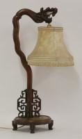 Lot 1119 - An early 20th century Chinese hardwood table lamp