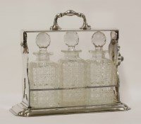 Lot 1127 - An Edwardian silver plated tantalus