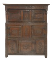 Lot 1366 - A 17th century and later carved oak duodarn