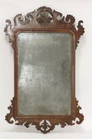 Lot 1404 - A 'Chippendale' walnut fret framed wall mirror