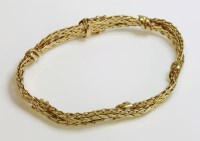 Lot 1027 - A 9ct gold plaited and textured bracelet