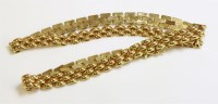 Lot 1032 - A 9ct gold two row panther link necklace