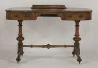 Lot 1385 - A Victorian burr walnut kidney shaped writing table