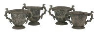 Lot 365 - A set of four lead urns