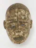 Lot 100 - A carved Dan 'passport' wooden mask