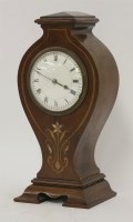 Lot 1238 - An Art Nouveau mahogany and inlaid mantel clock