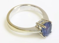 Lot 1006 - A white gold single stone sapphire ring