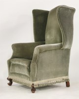 Lot 1415 - A Queen Anne style shaped wing back armchair