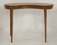 Lot 1459 - A George III kidney shaped writing table