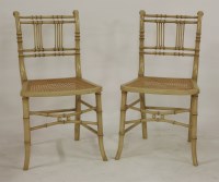 Lot 1461 - A pair of Regency painted simulated bamboo side chairs