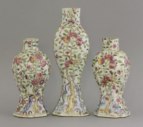 Lot 607 - A garniture of three famille rose Vases
