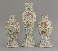 Lot 607 - A garniture of three famille rose Vases