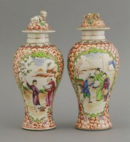 Lot 614 - An unusual pair of famille rose Vases and Covers