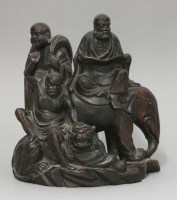 Lot 290 - An unusual wood Group of three Buddhist Immortals
