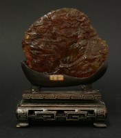 Lot 146 - A large and rare amber Carving