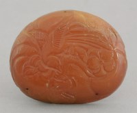Lot 243 - A peach-shaped Amber Plaque