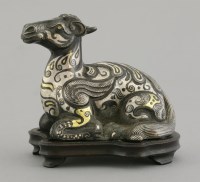 Lot 595 - An inlaid bronze mythical beast