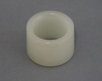 Lot 602 - A pale green jade Archer's Ring