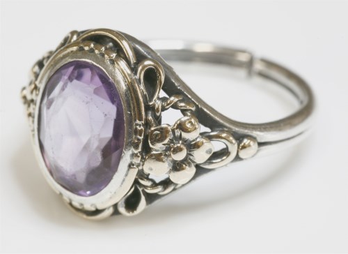 Lot 19 - An Arts and Crafts silver and gold amethyst ring