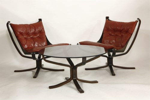 Lot 631 - A pair of Falcon beechwood and leather lounge chairs