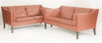 Lot 658 - A pair of Danish leather two-seater settees