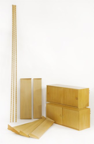 Lot 564 - A wall-mounted shelving system