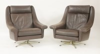 Lot 588 - A pair of brown leather armchairs