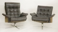 Lot 648 - A pair of high end low leather armchairs