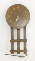 Lot 40 - An Arts and Crafts oak wall clock