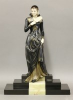 Lot 233 - An Art Deco patinated spelter ivorine table centre