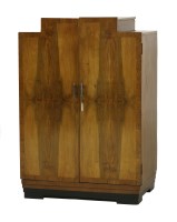 Lot 146 - An Art Deco walnut dressing cupboard