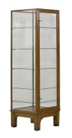 Lot 150 - An oak tall display cabinet