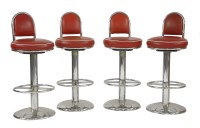 Lot 486 - A set of four chrome bar stools