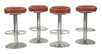 Lot 487 - A set of four chrome bar stools