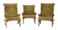 Lot 553 - A set of three oak wing armchairs