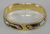 Lot 4 - A gold-plated hinged and enamel decorated bangle