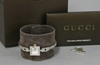 Lot 12 - A lady's diamond set Gucci 102 Mini G stainless steel quartz bracelet watch