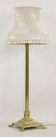 Lot 1488 - A brass corinthian column adjustable height lamp standard