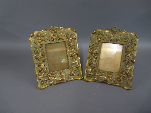 Lot 1233 - A pair of late Victorian gilt bronze photograph frames