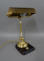 Lot 1234 - An early 20th century brass adjustable desk lamp