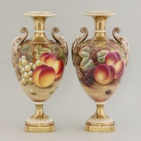 Lot 1093 - A pair of Royal Worcester urns