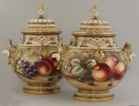 Lot 1096 - A pair of Royal Worcester massive urns and covers