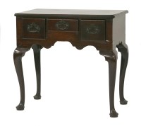 Lot 1528 - A Georgian mahogany lowboy