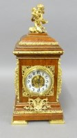 Lot 1318 - An Edwardian oak mantel clock