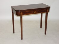 Lot 1574 - A George III strung mahogany fold over tea table