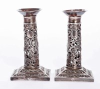 Lot 24 - A pair of Chinese silver candlesticks