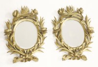 Lot 1568 - A pair of carved and gilt wall mirrors