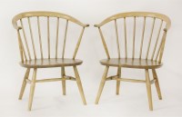 Lot 523 - A pair of Ercol Cowhorn low armchairs