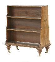 Lot 557 - A yew wood waterfall bookcase